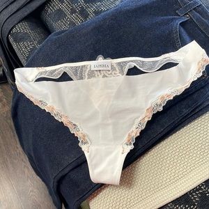 Brand new LA PERLA thong panties.  Never worn lacy trim ivory thong. Size small.